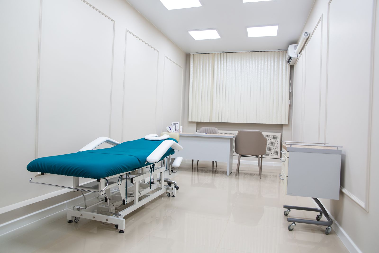 Clean modern medical exam room ready for patients